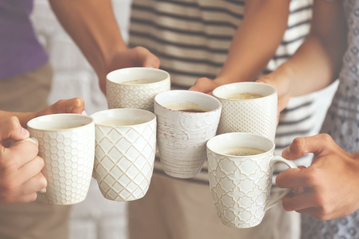 Group of Friends Enjoying Cups of Coffee